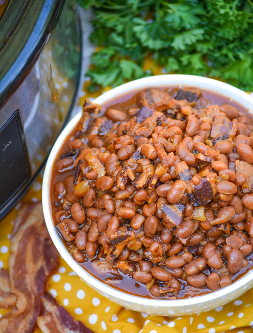 SLOW COOKER BAKED BEANS IN A WHITE BOWL