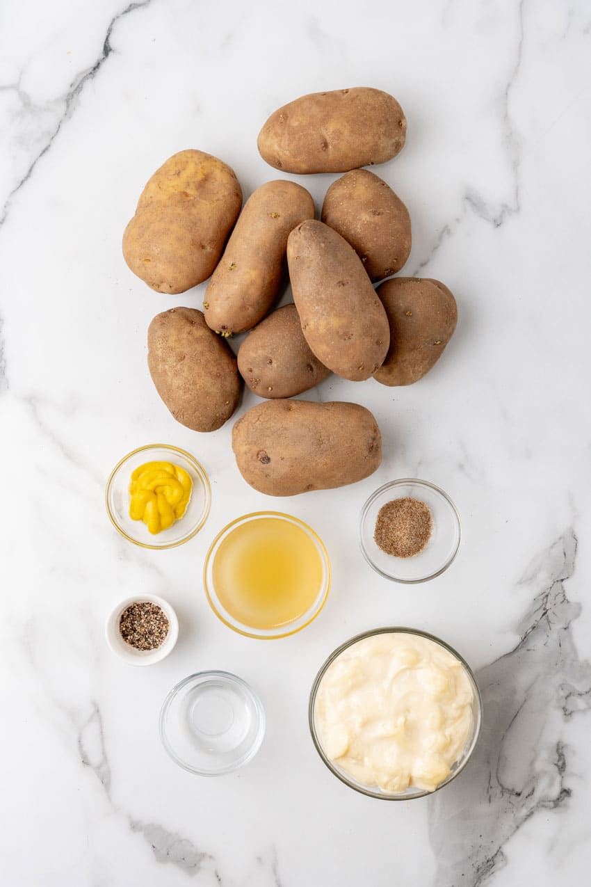 an overhead image showing the measured ingredients needed to make a batch of grandma's simple southern potato salad