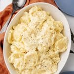 grandma's simple southern potato salad in a white serving bowl