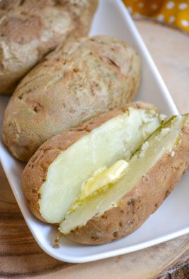 10 MINUTE MICROWAVE BAKED POTATOES ON A WHITE SERVING PLATTER