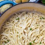 creamy garlic parmesan pasta in a large blue dutch oven