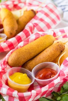 CORN DOGS IN PAPER LINED PLASTIC FOOD BASKETS
