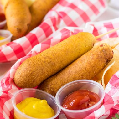 CORN DOGS IN PAPER LINED PLASTIC FOOD BASKETS