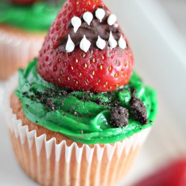 MONSTER STRAWBERRY CUPCAKES ON A WHITE SERVING PLATTER