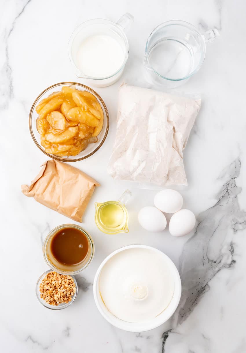 an overhead image showing the measured ingredients needed to make an apple spice poke cake