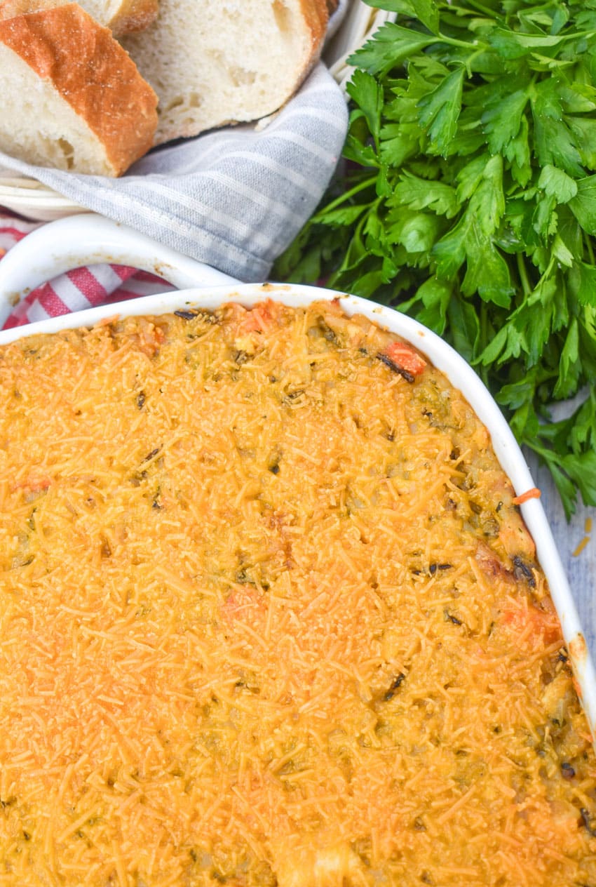cheesy chicken wild rice casserole in a white baking dish