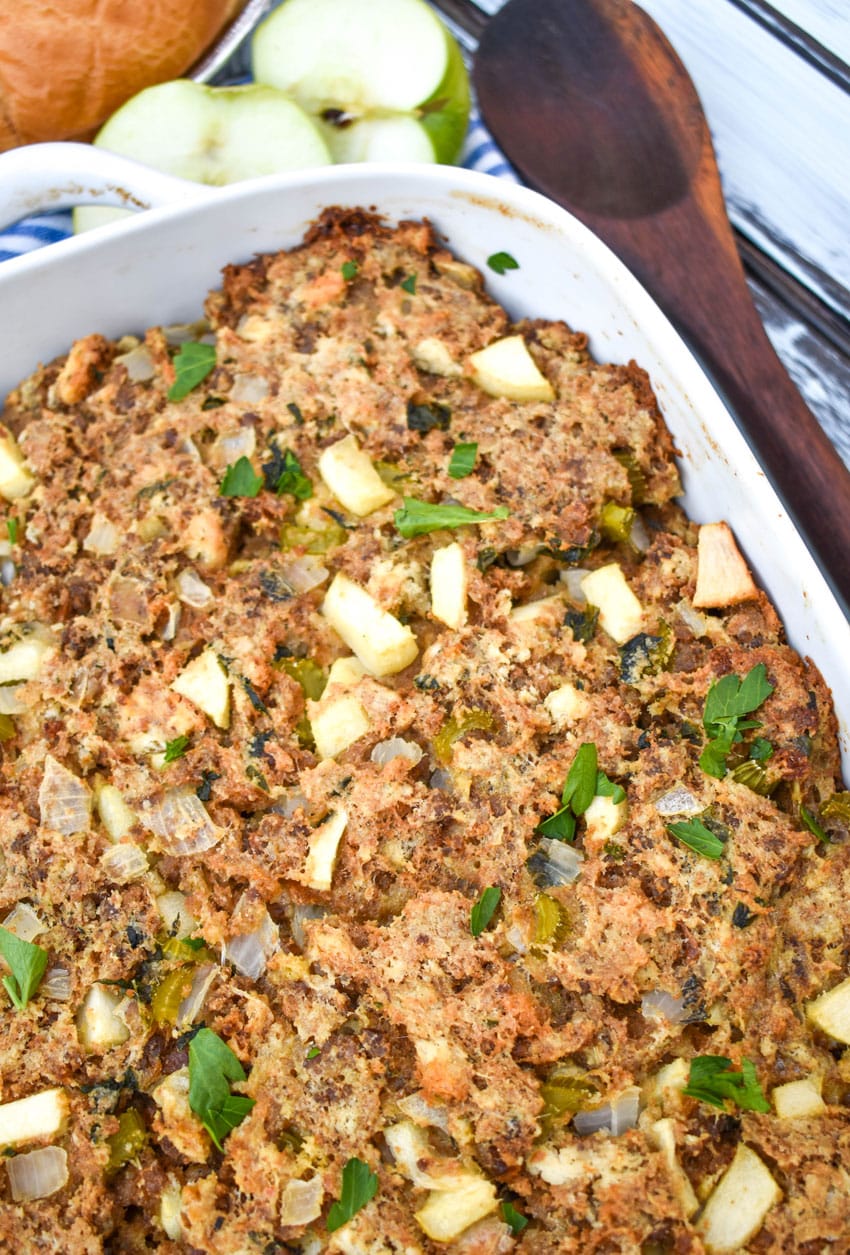 sausage, apple, and sage dressing in a white baking dish