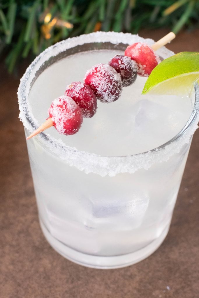 glass of margarita with berries on top