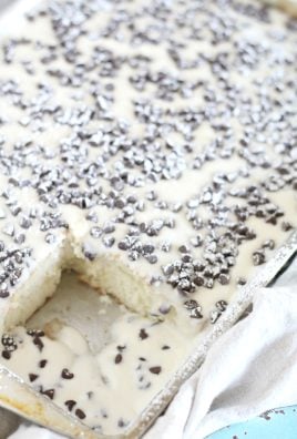 an italian cannoli poke cake in a metal baking pan