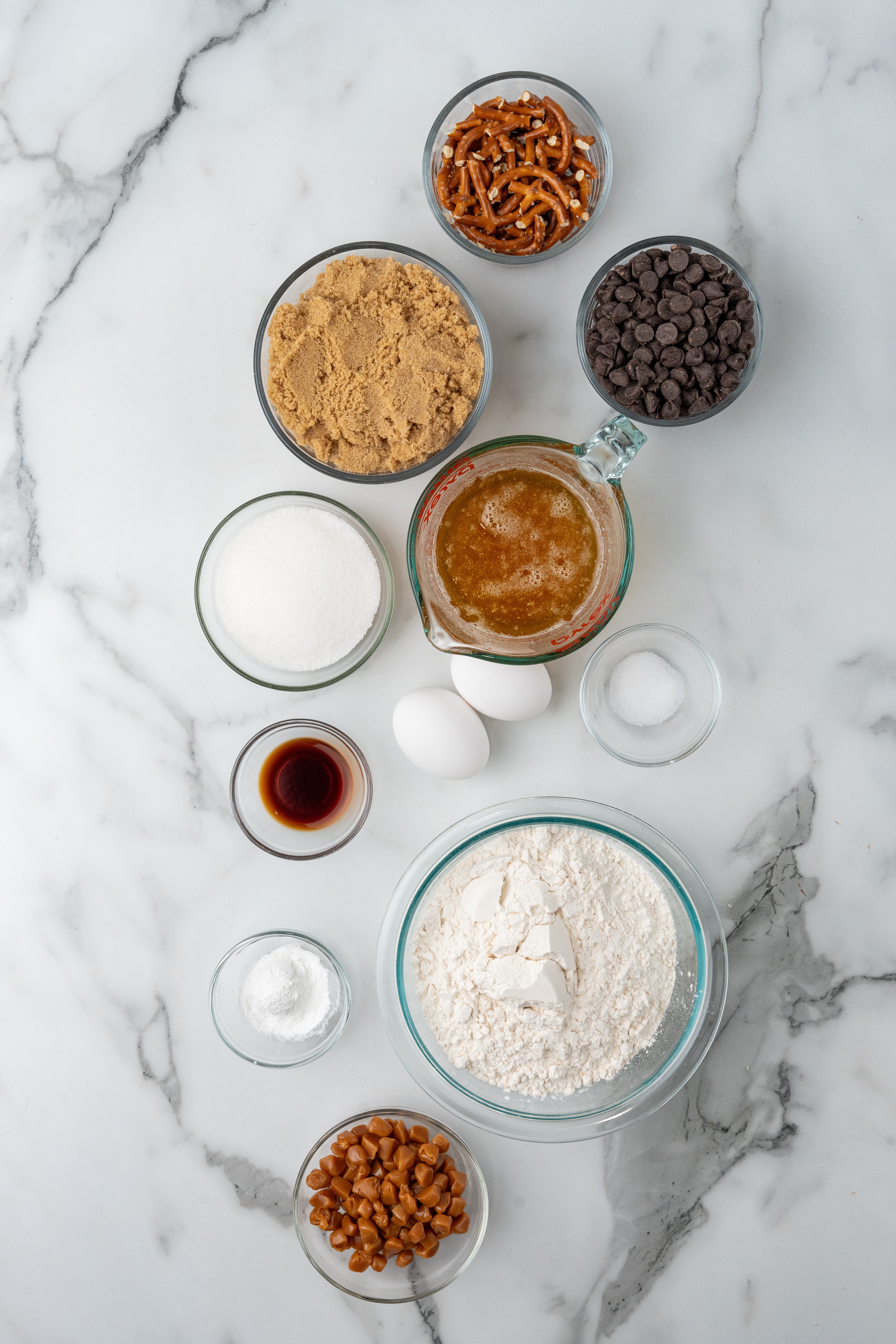 an overhead image showing the measured ingredients needed to make a batch of copycat panera bread kitchen sink cookies