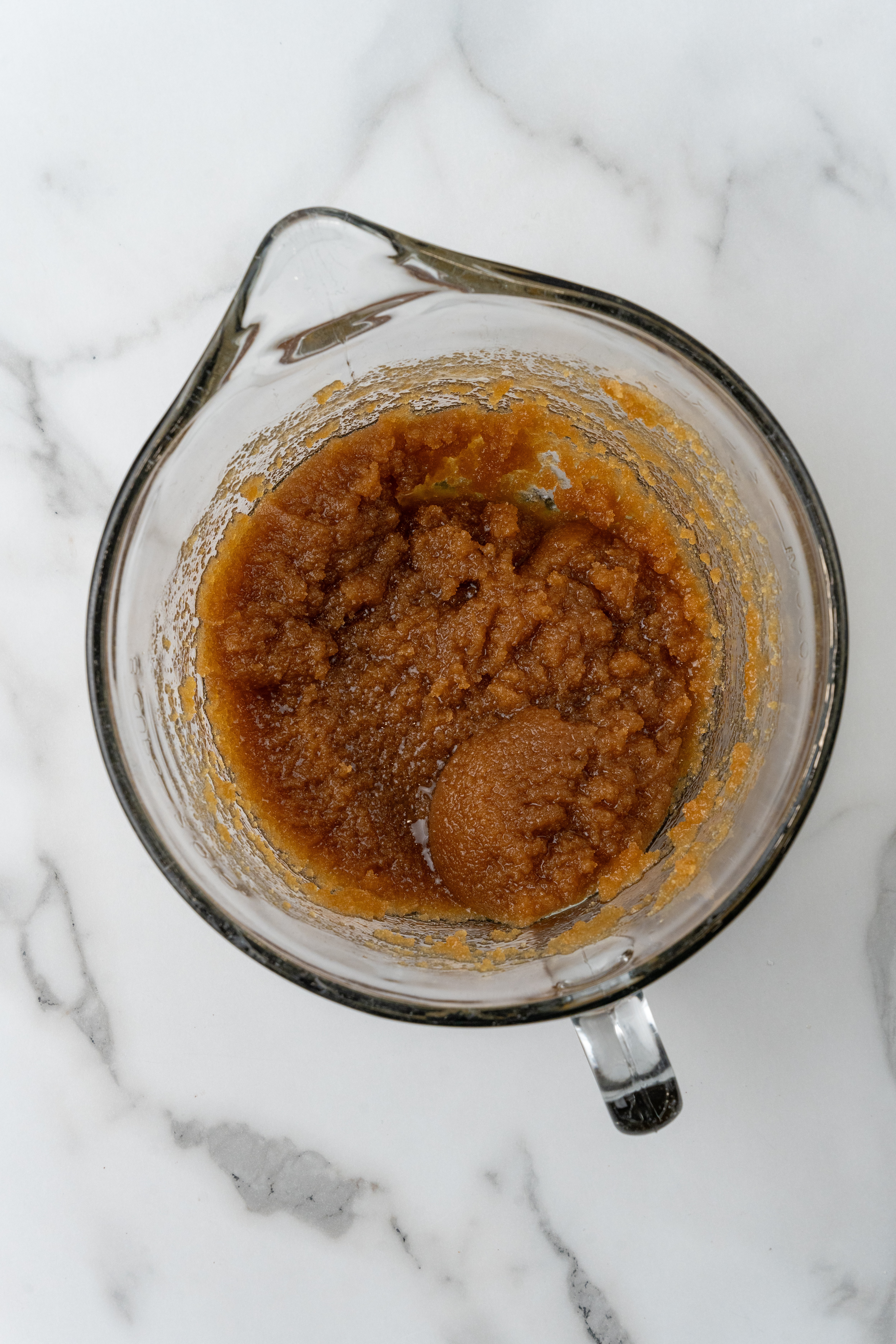 browned butter in a glass measuring cup
