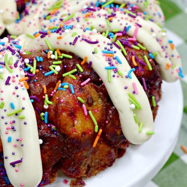 FROSTED UNICORN CINNAMON MONKET BREAD ON A WHITE CAKE STAND