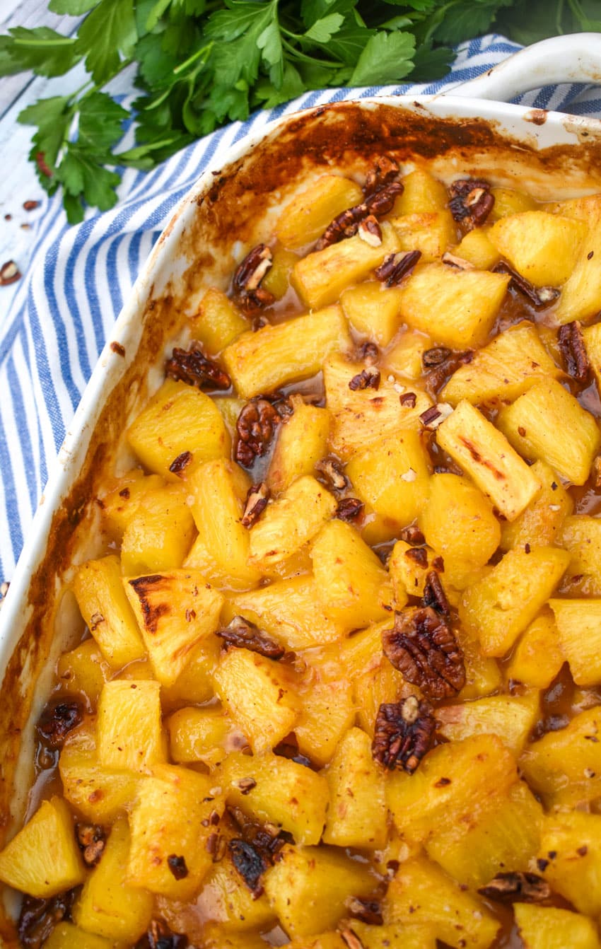 brown sugar roasted pineapples in a white casserole dish