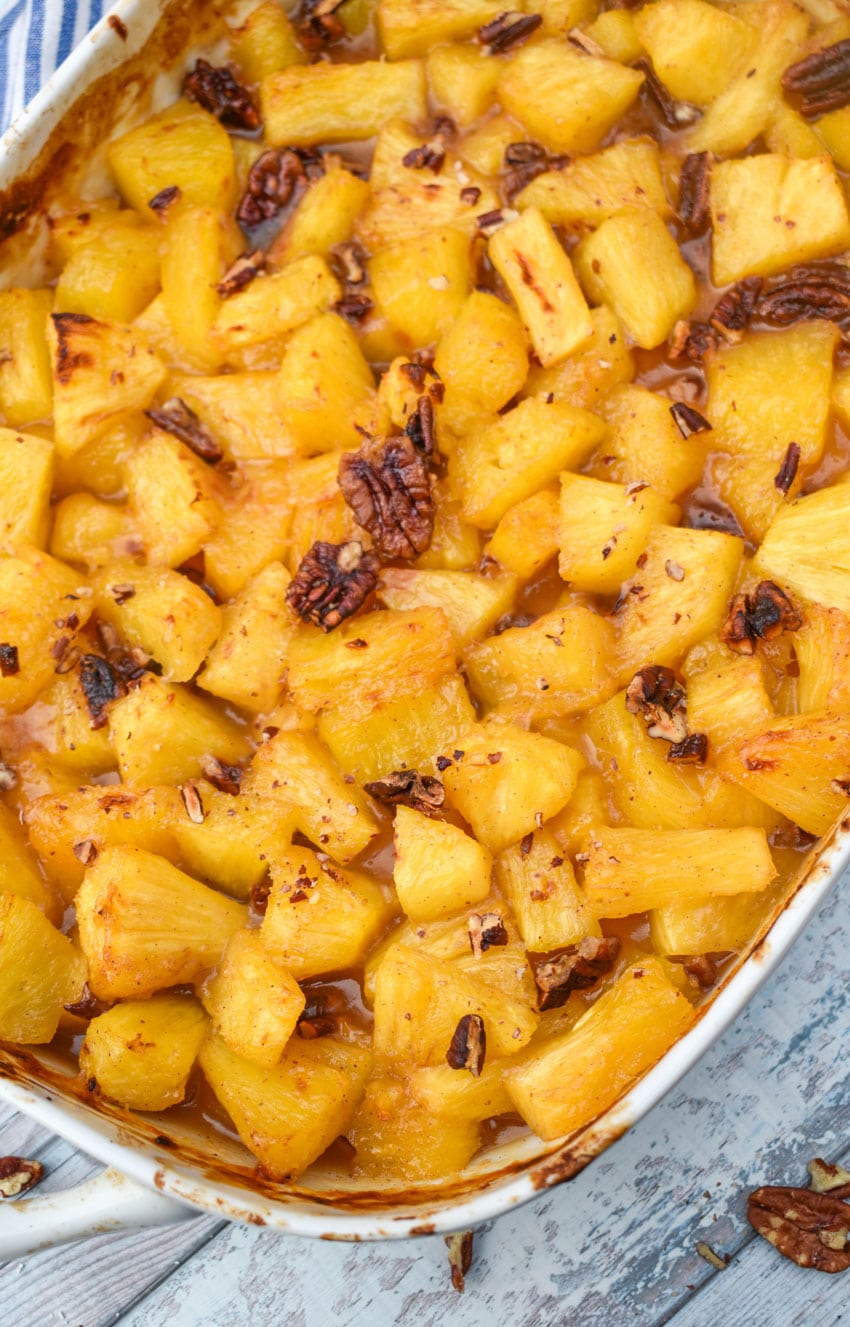 brown sugar roasted pineapples in a white casserole dish