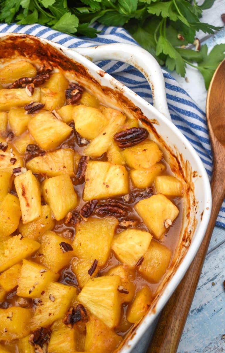 brown sugar roasted pineapples in a white casserole dish