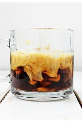 A succession of three pictures showing the coffee being poured, the cream added, and the two swirling in the full mug