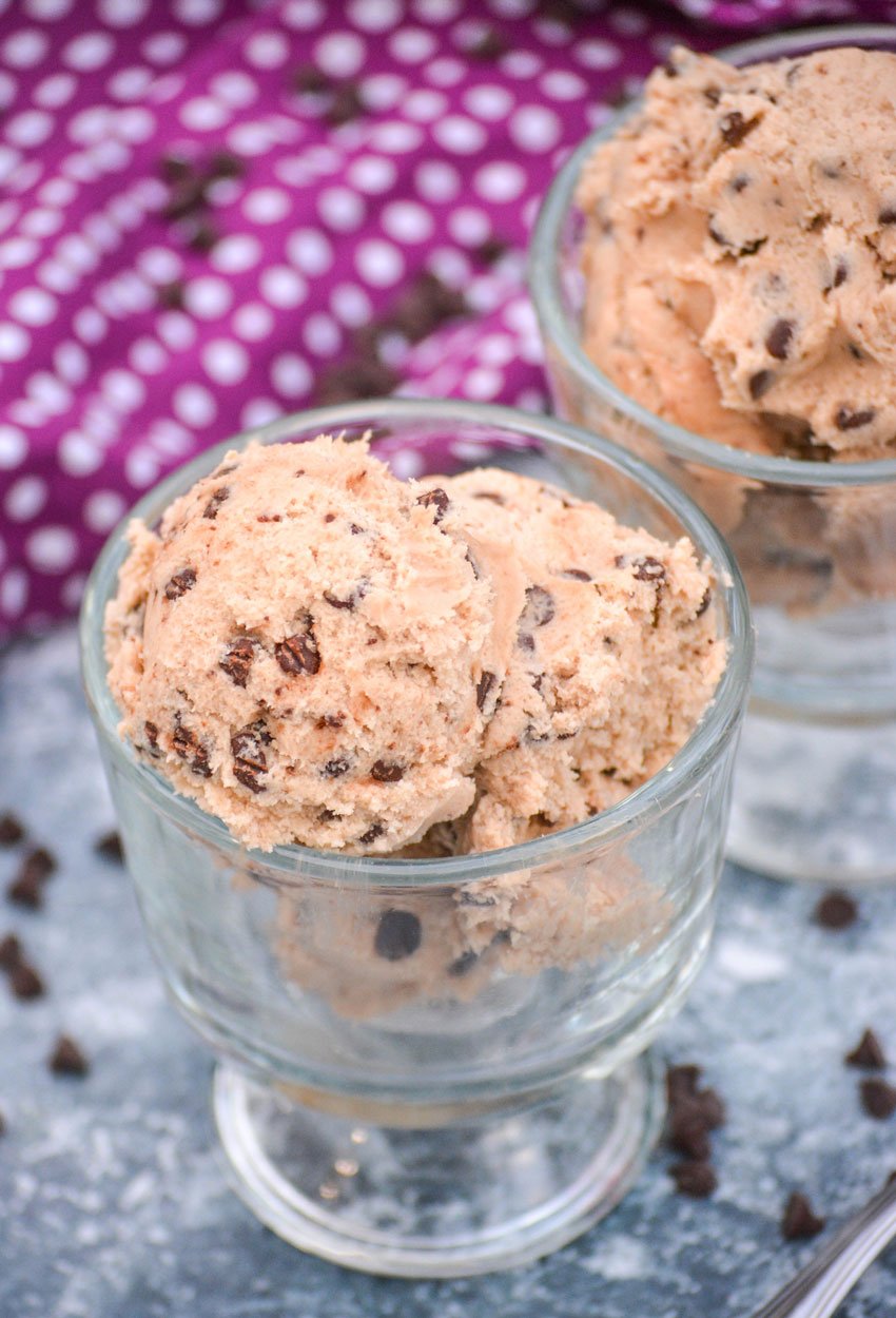 SCOOPS OF EDIBLE CHOCOLATE CHIP COOKIE DOUGH IN TWO SMALL GLASS BOWLS