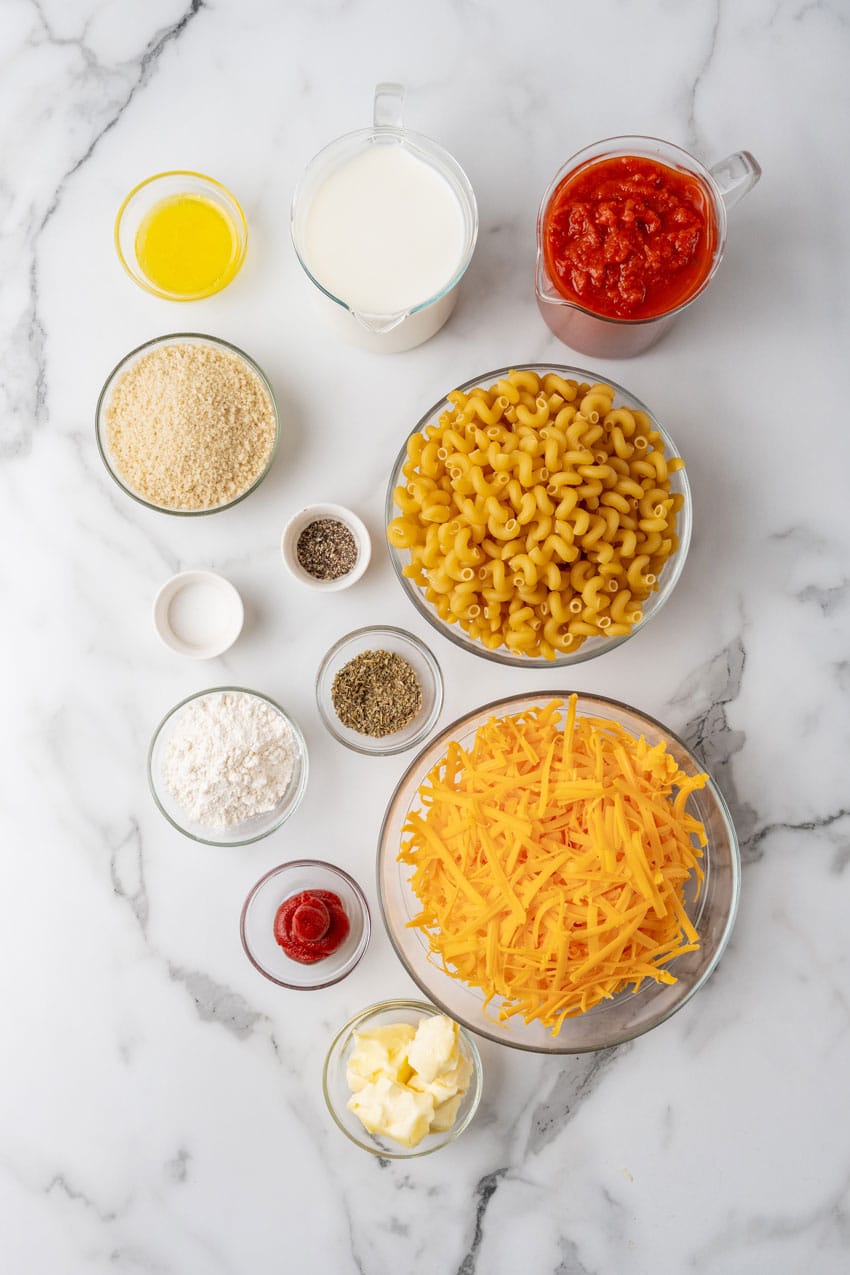 an overhead image showing the measured ingredients needed to make a batch of creamy tomato soup macaroni and cheese