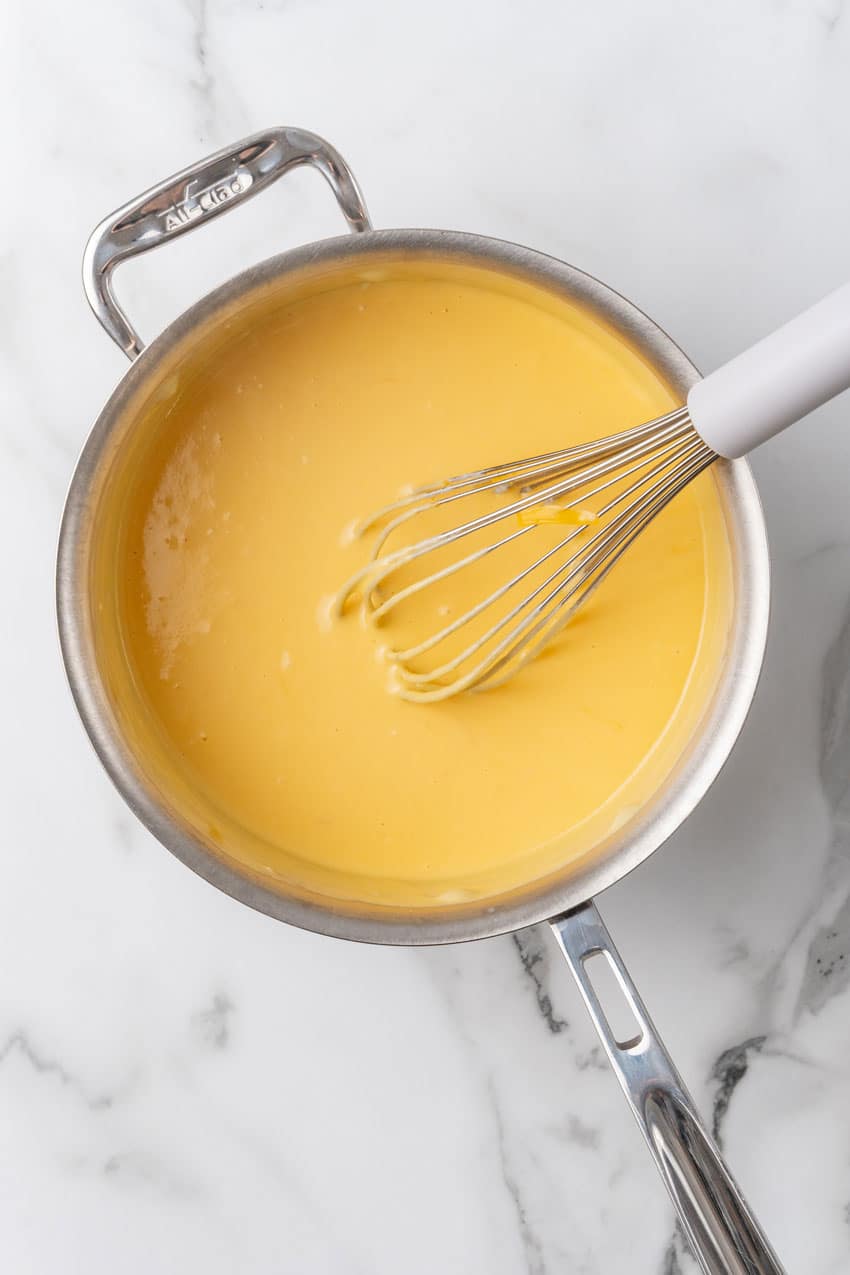 homemade cheese sauce in a large metal skillet
