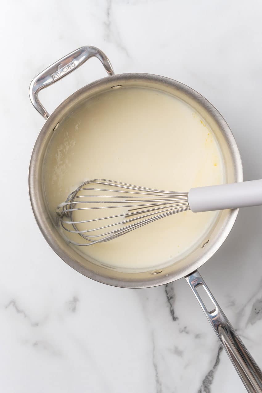 homemade cheese sauce in a large metal skillet