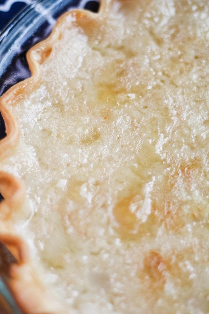 a vintage water pie recipe shown with a blue cloth napkin in the background