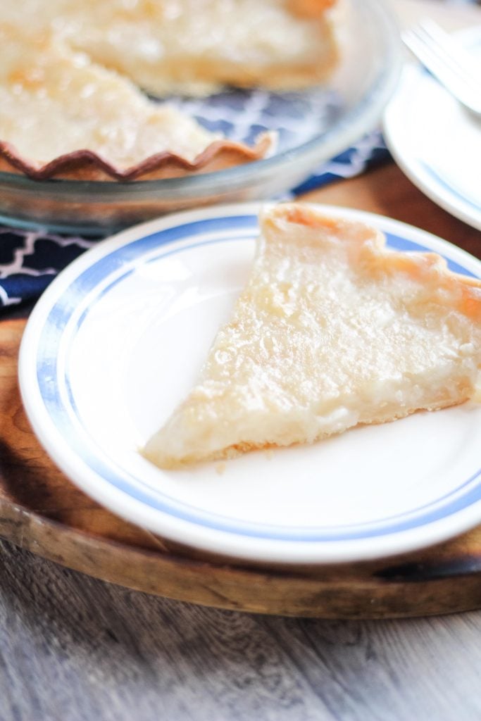 a slice of water pie on a white blue-rimmed plate