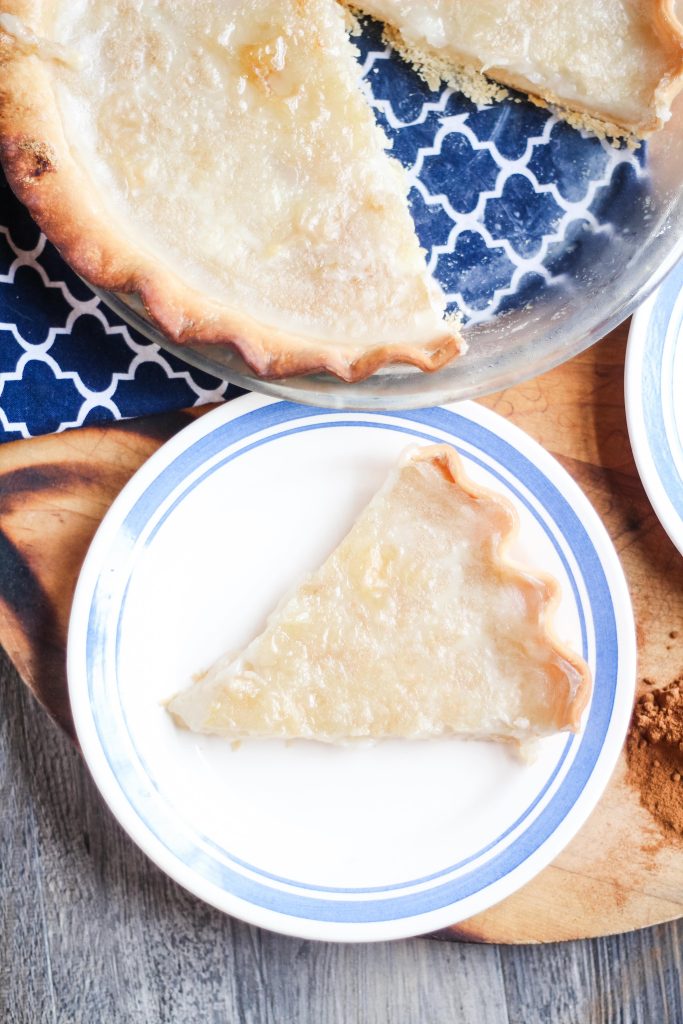 a slice of water pie on a white blue-rimmed plate