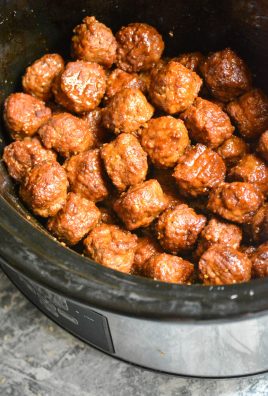 saucy Asian meatballs shown in the bowl of a slow cooker