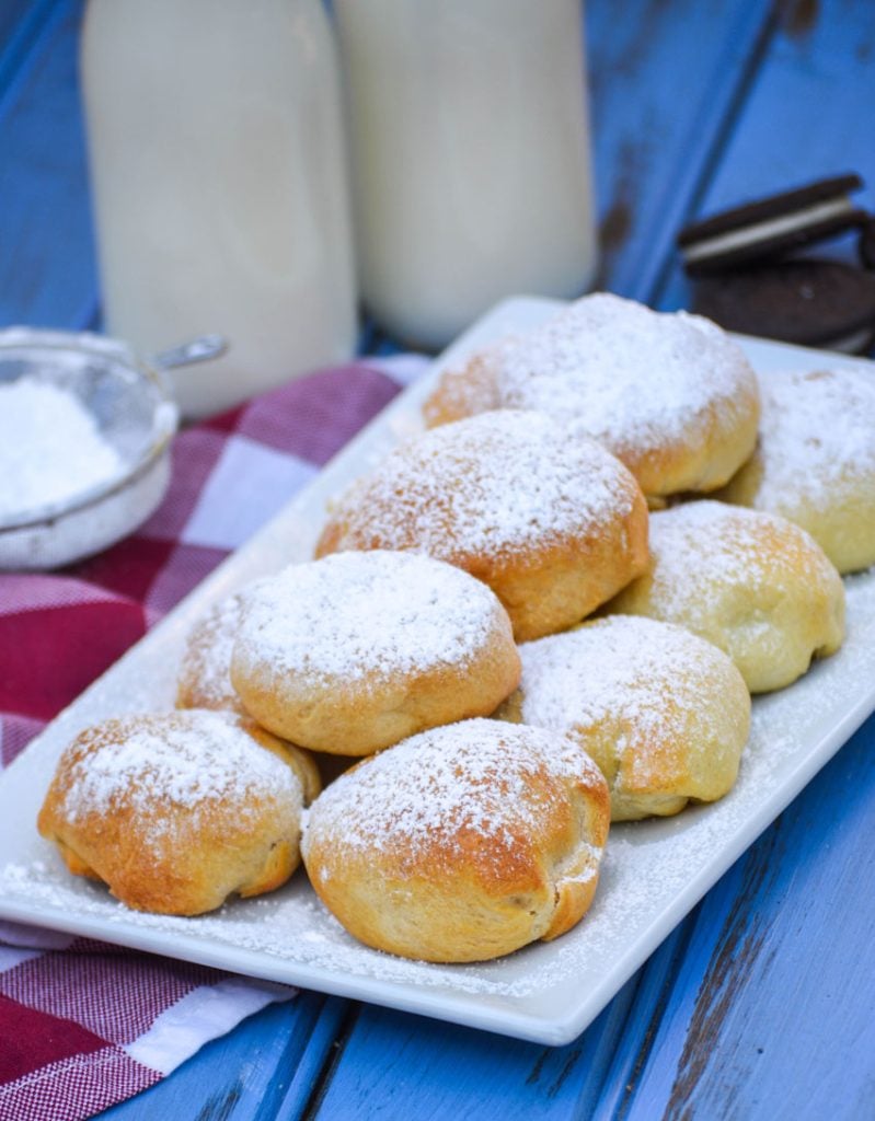 air fryer fried oreos sprinkled with powdered sugar and serve on a white platter