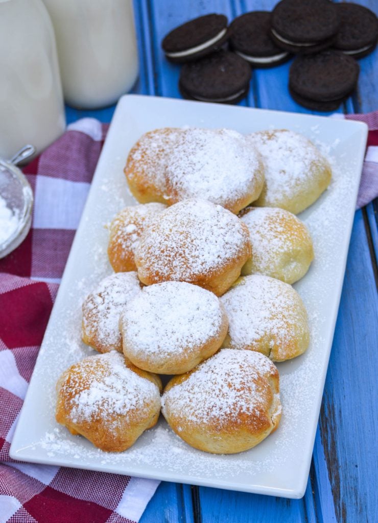 air fryer fried oreos sprinkled with powdered sugar and serve on a white platter