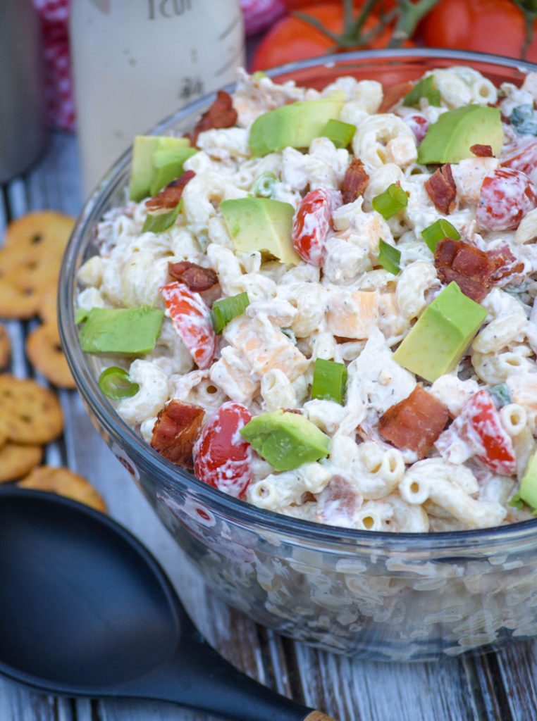 chicken club pasta salad in a large glass mixing bowl