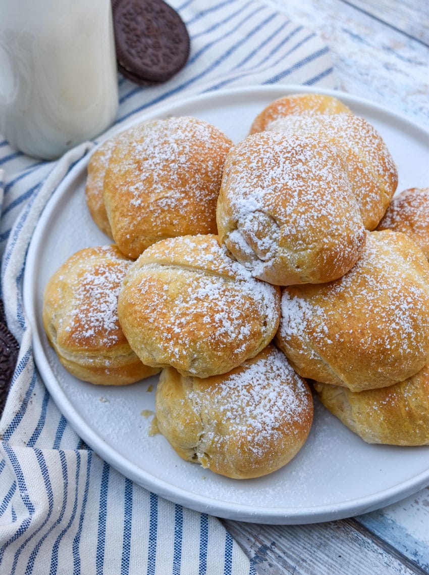 a pile of easy air fried oreos on a white serving plate