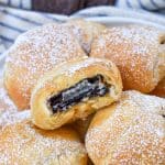 a pile of easy air fried oreos on a white serving plate