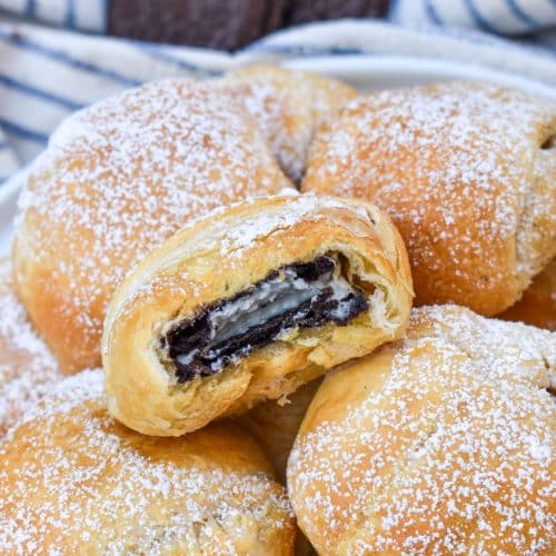 a pile of easy air fried oreos on a white serving plate