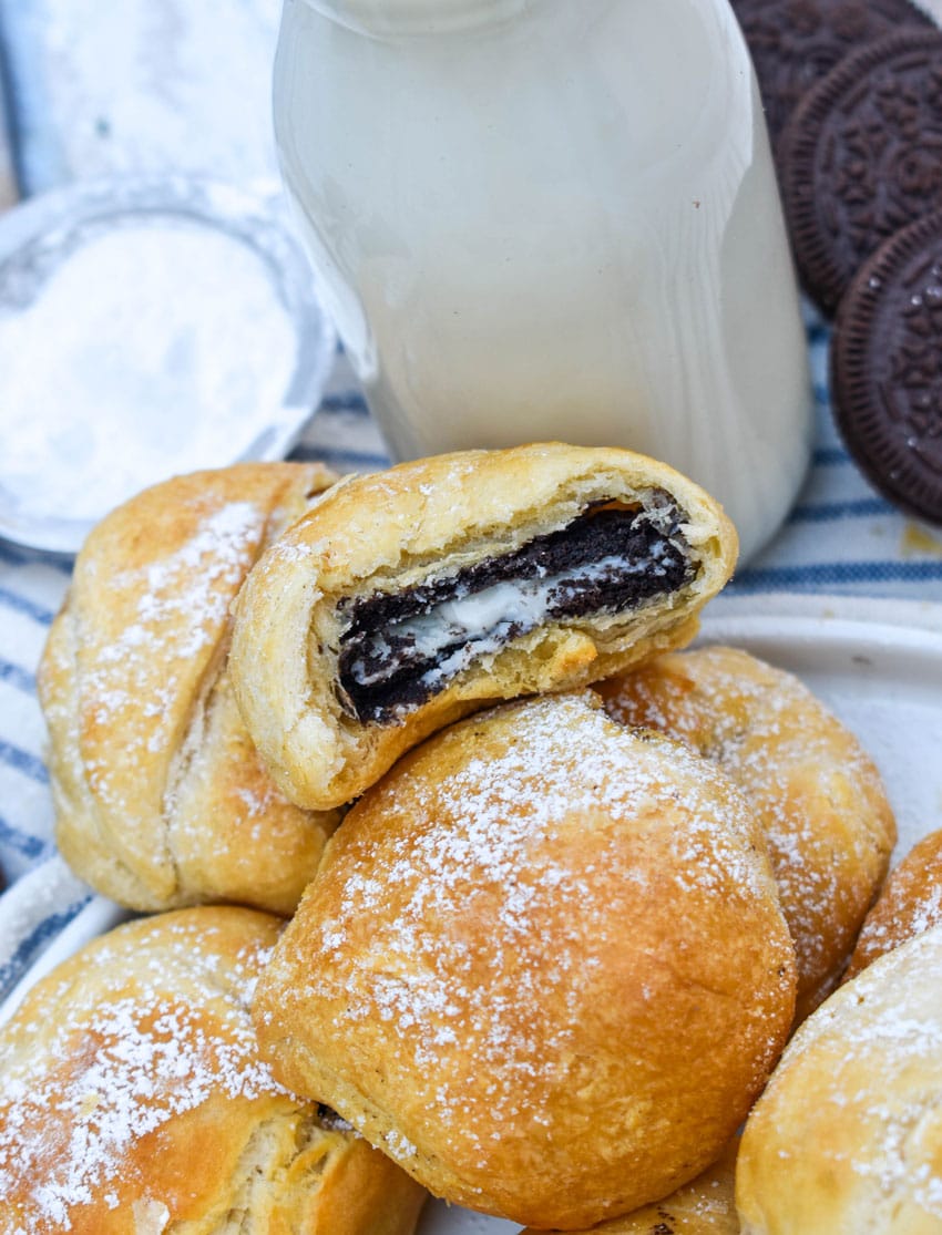 a pile of easy air fried oreos on a white serving plate