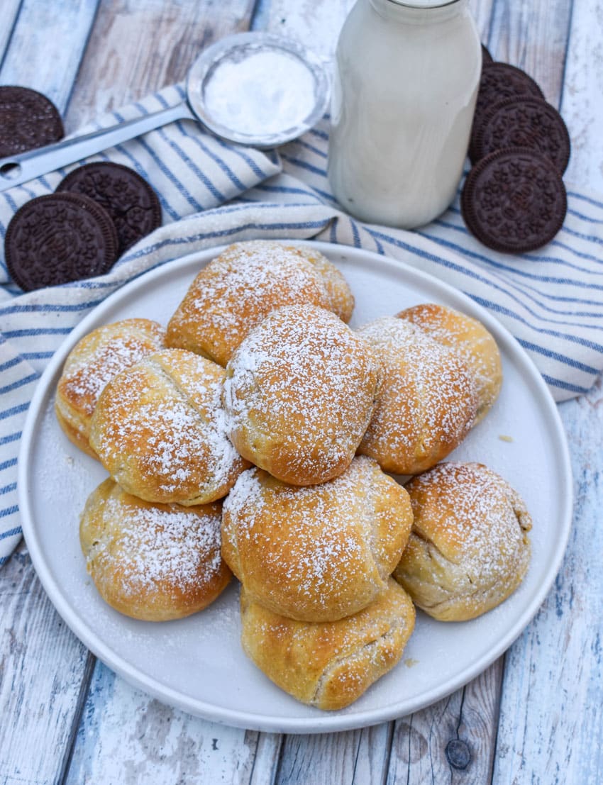 a pile of easy air fried oreos on a white serving plate