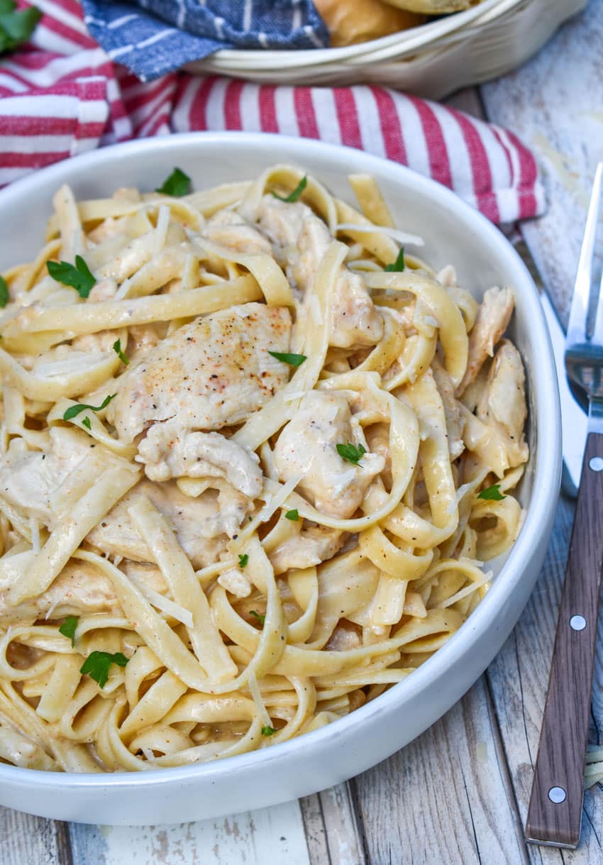 creamy cajun chicken alfredo in a gray bowl
