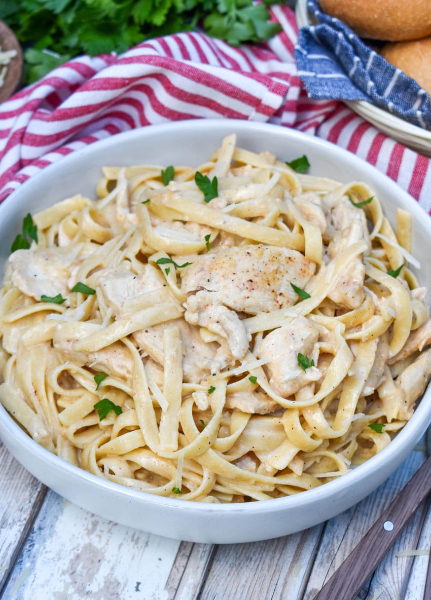 creamy cajun chicken alfredo in a gray bowl