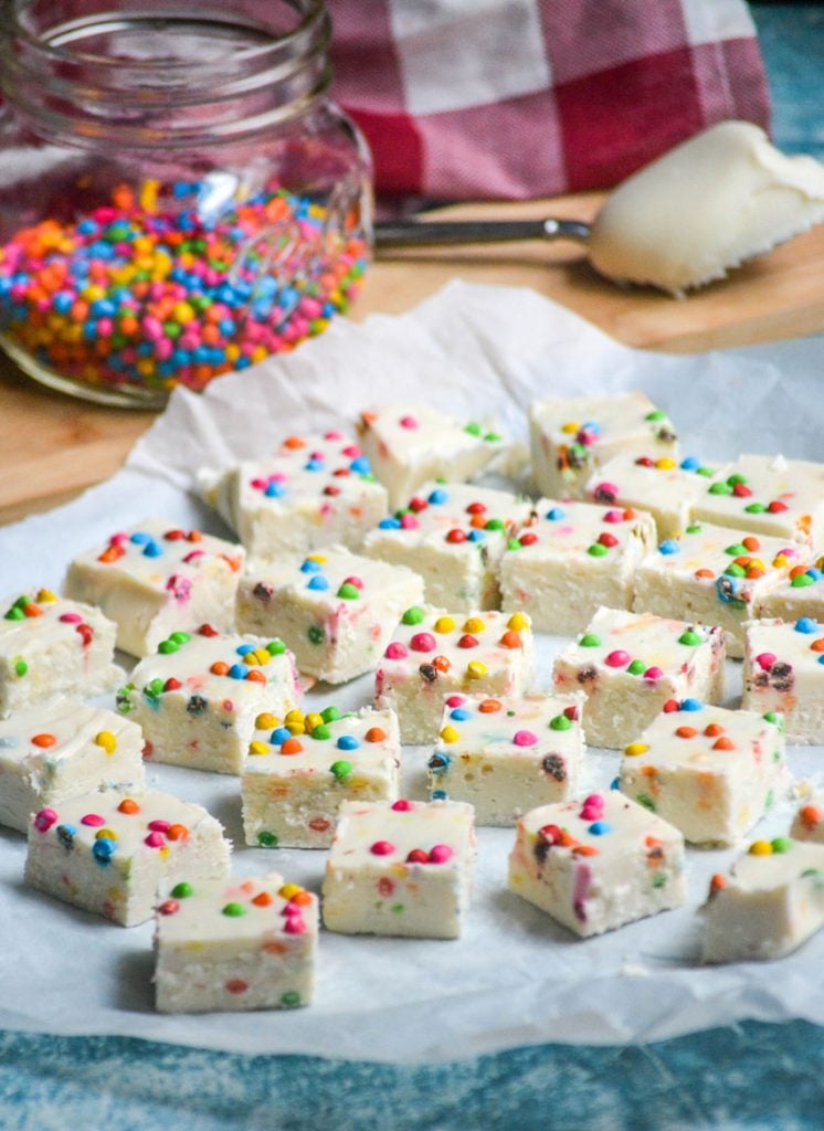 rainbow chip fudge made from frosting shown on parchment paper