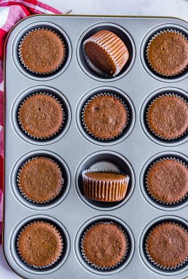 freshly baked gingerbread cupcakes shown in a metal baking tin