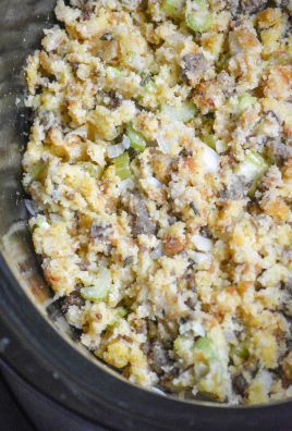 slow cooker cornbread & sausage stuffing shown in the black ceramic crock of a crockpot slow cooker