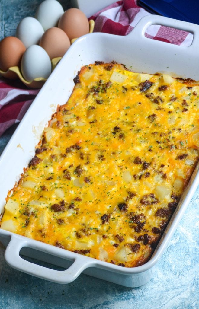 an Amish breakfast casserole baked in a white rectangular baking dish