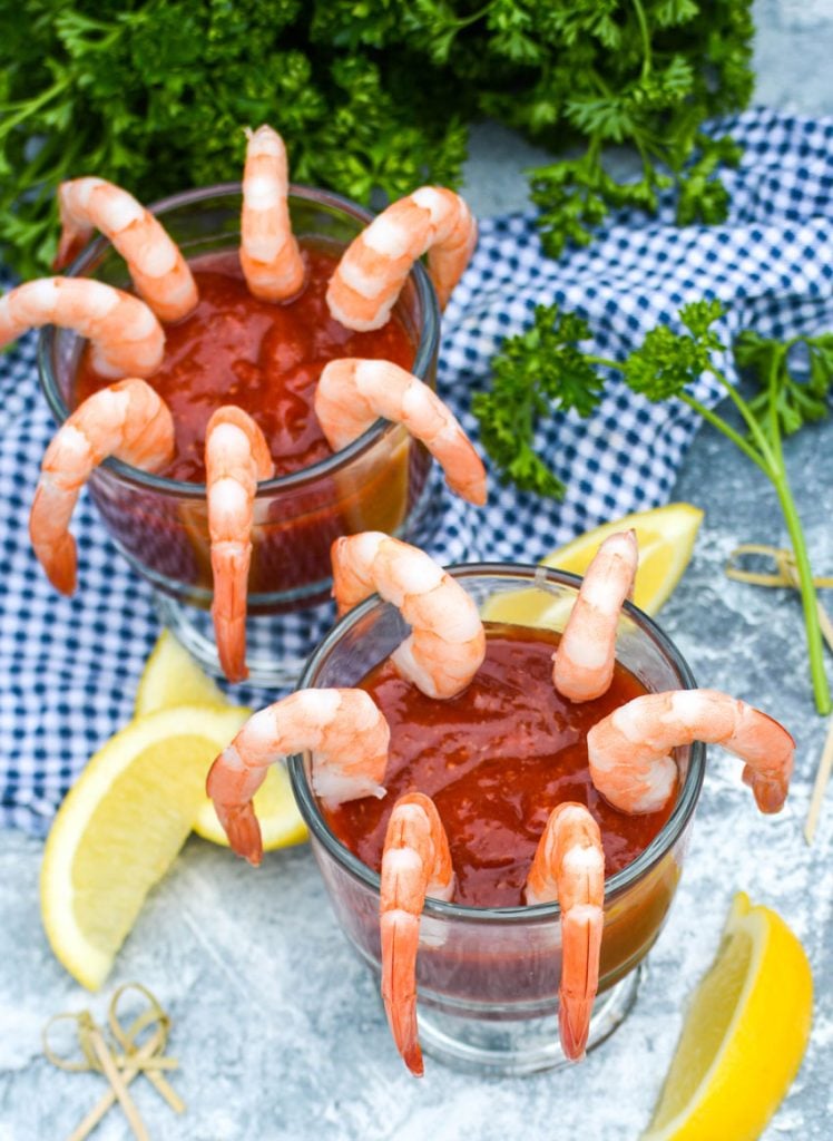 easy homemade cocktail sauce served in glass bowls rimmed with chilled steamed shrimp