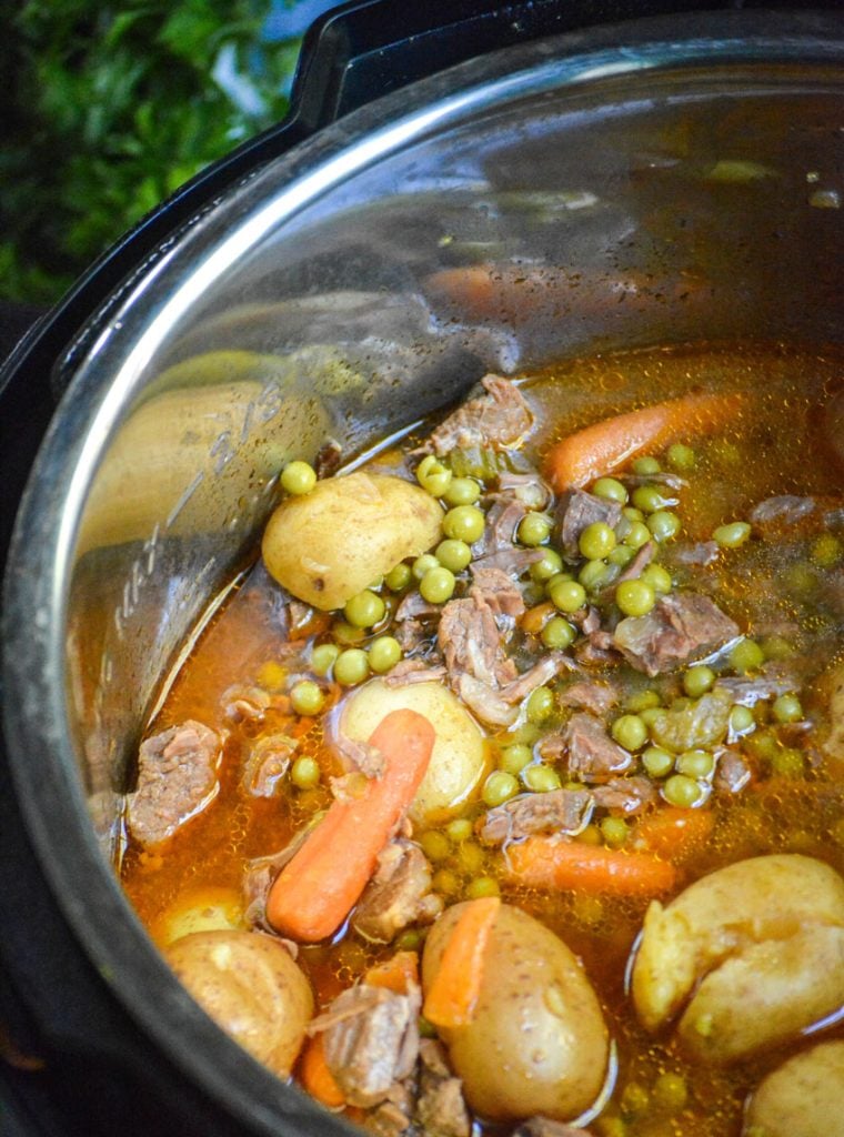 savory beef stew shown in the bowl of an instant pot