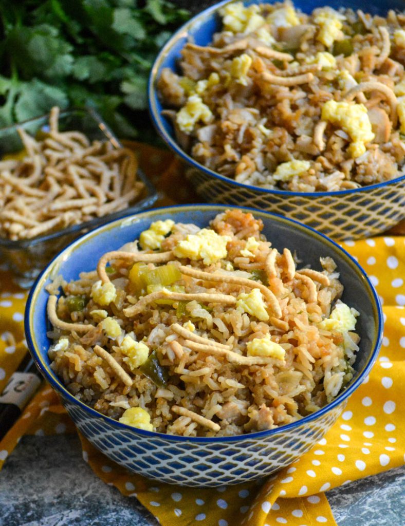 oven baked chicken fried rice shown in a blue bowls