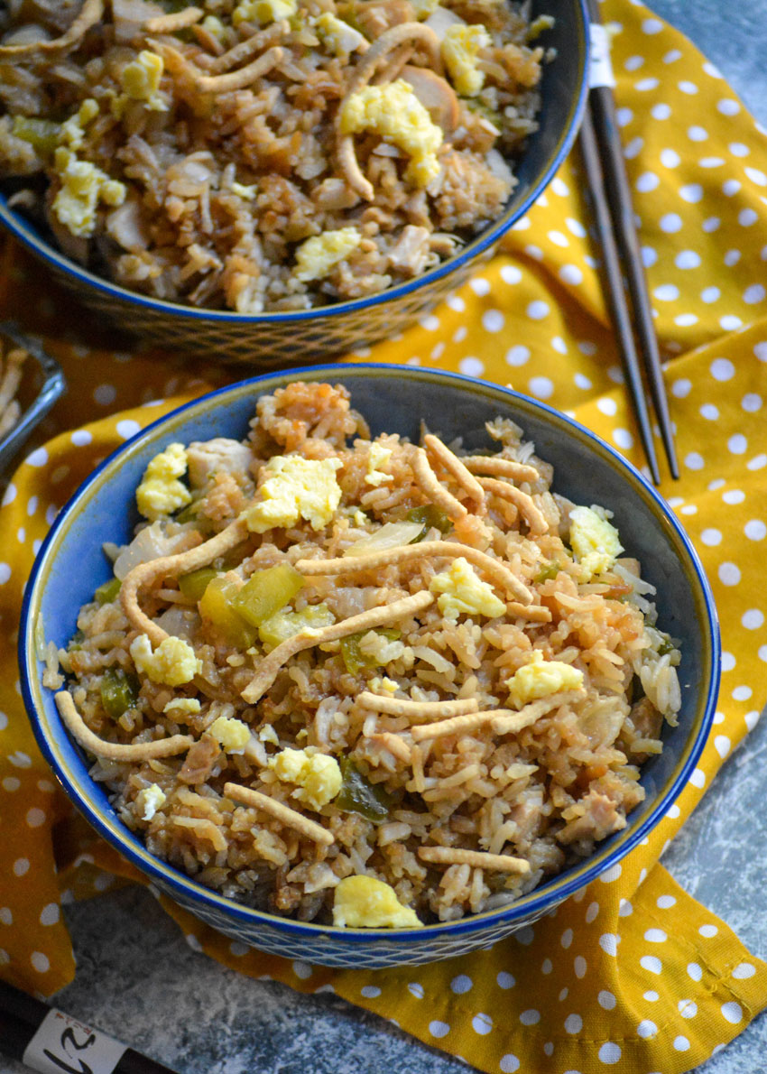 oven baked chicken fried rice shown in a blue bowls