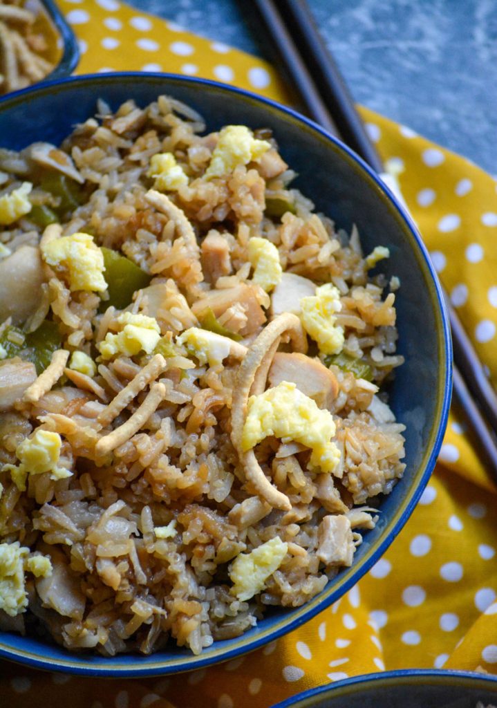 oven baked chicken fried rice shown in a blue bowl