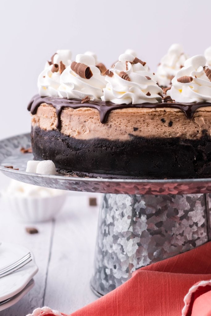 hot chocolate cheese cake on a metal cake stand