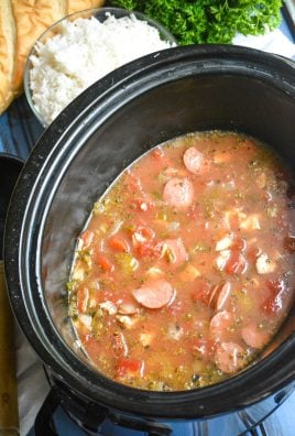 slow cooker jambalaya stew shown in the black bowl of a crockpot