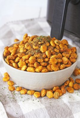 a white bowl filled with air fryer taco seasoned oyster crackers